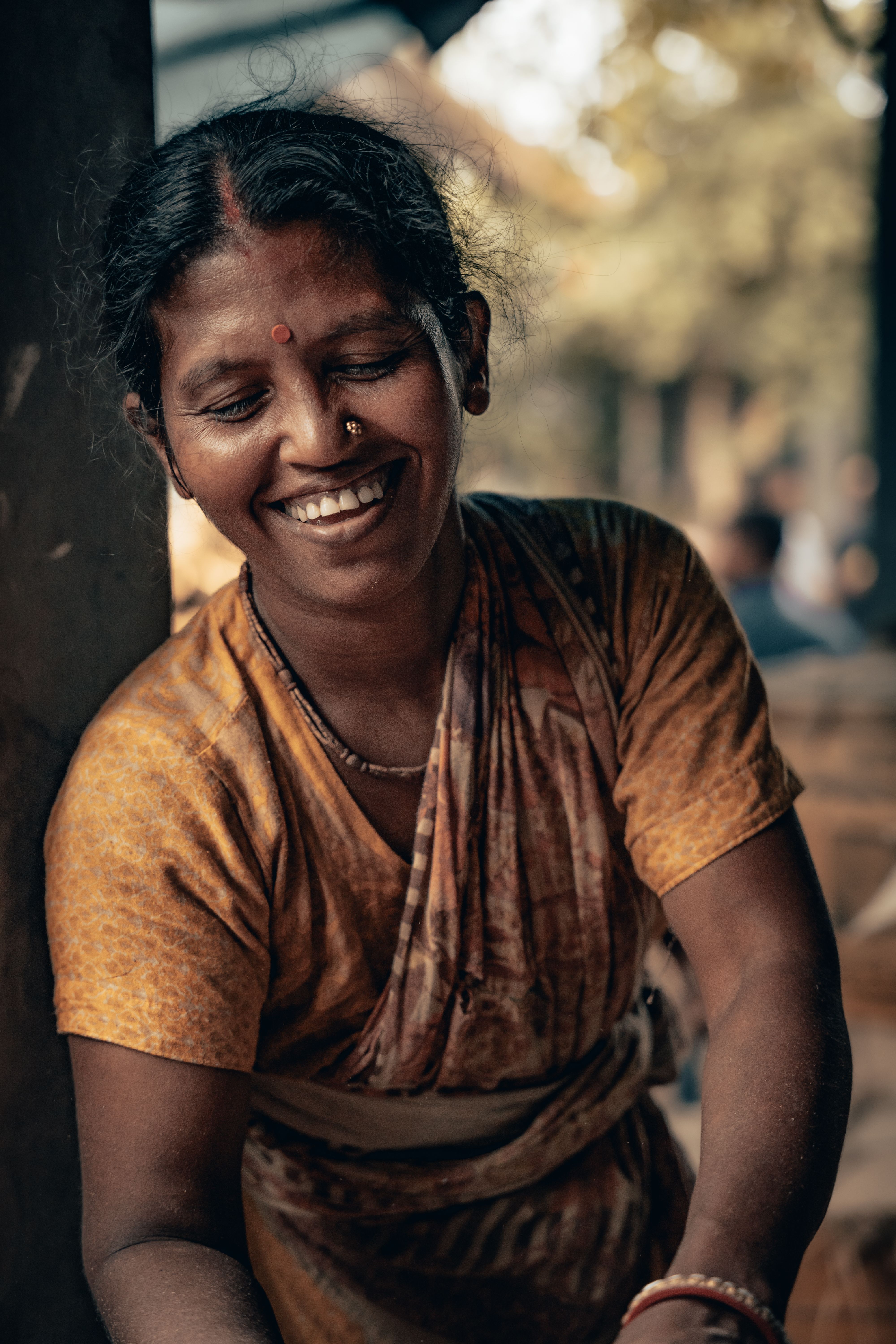 Smiling Woman in Traditional Attire Outdoors · Free Stock Photo