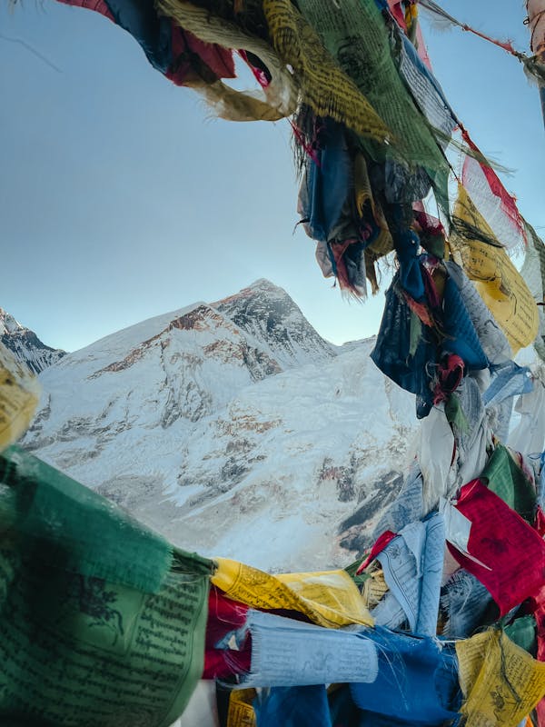 Mount Everest framed by colourful Tibetan prayer flags