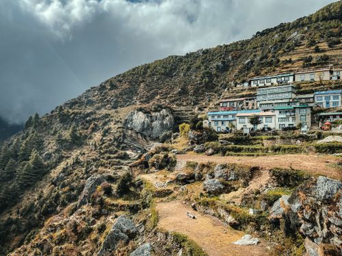 Free Captivating landscape of Namche in Nepal's Himalayas, showcasing lush greenery and traditional homes. Stock Photo