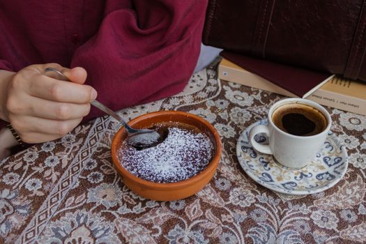 Enjoy a traditional Turkish coffee paired with a delicious dessert in İstanbul's charming atmosphere.