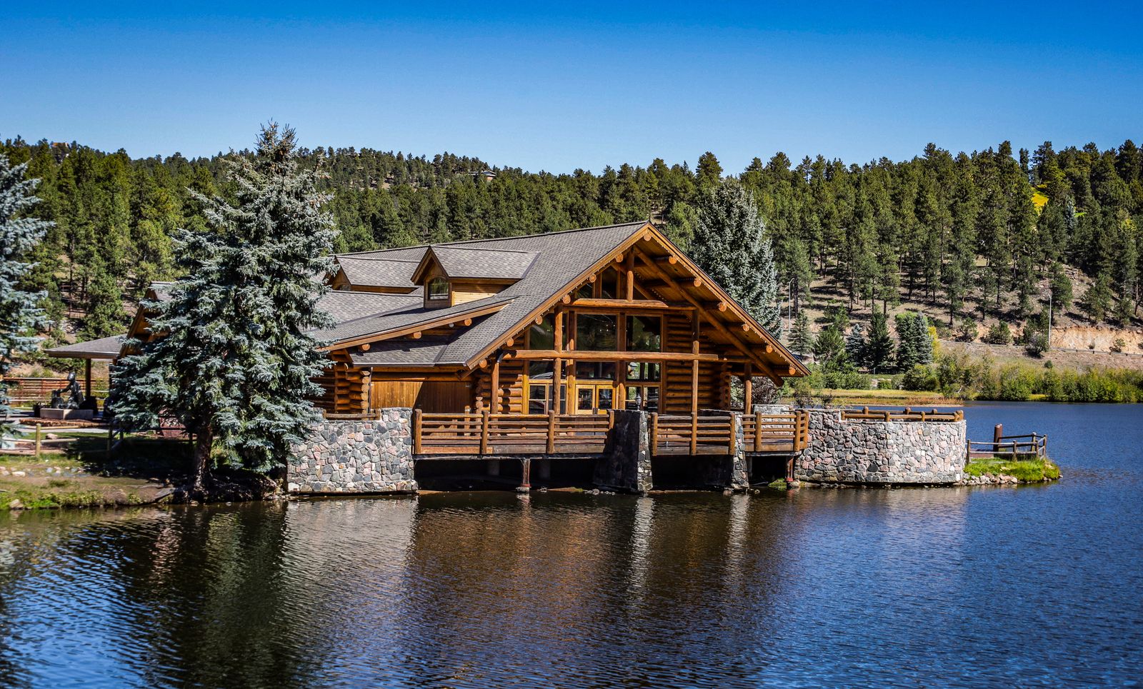 Lakeside log cabin tucked among pines on a quiet northern lake