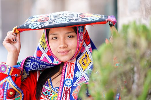 A Quechua woman wearing colorful traditional attire in Cusco, Peru, showcasing rich textile patterns.