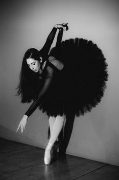 Stunning black and white photo of a ballet dancer in motion, showcasing grace and poise.