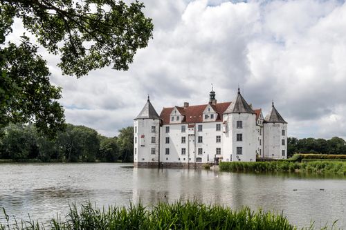 Free Explore the idyllic and regal architecture of Glücksburg Castle, a historical landmark in Germany. Stock Photo