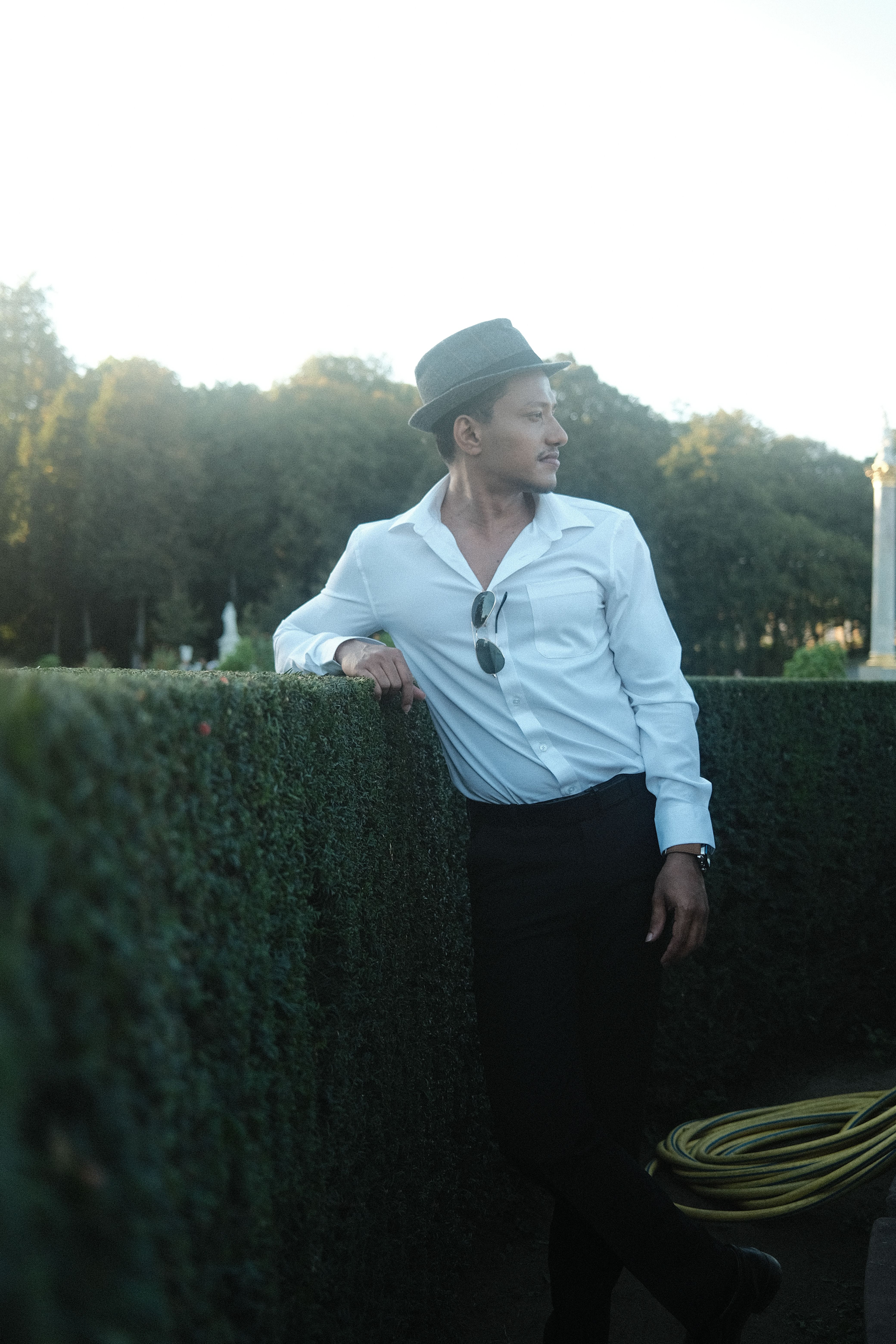 Stylish Man Posing Outdoors in Classic Attire · Free Stock Photo