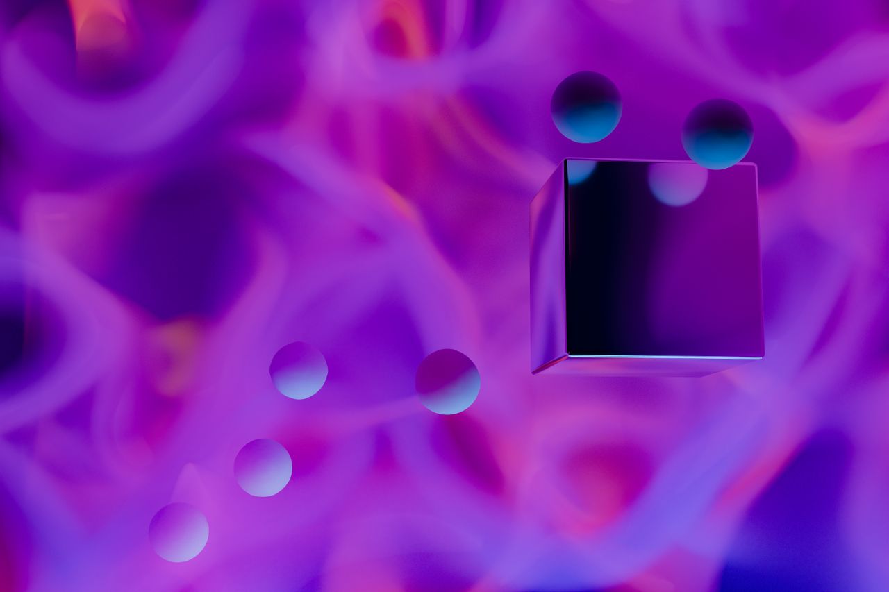 colorful abstract art with 3d spheres and cube against a vibrant purpl