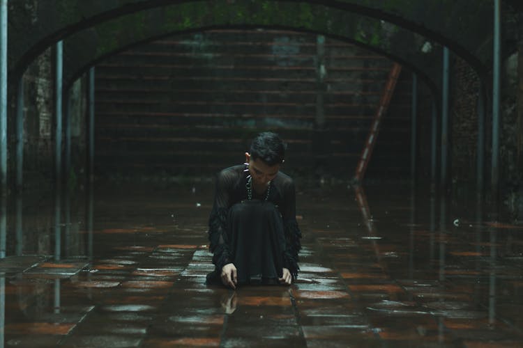 Man Sitting On Wet Floor