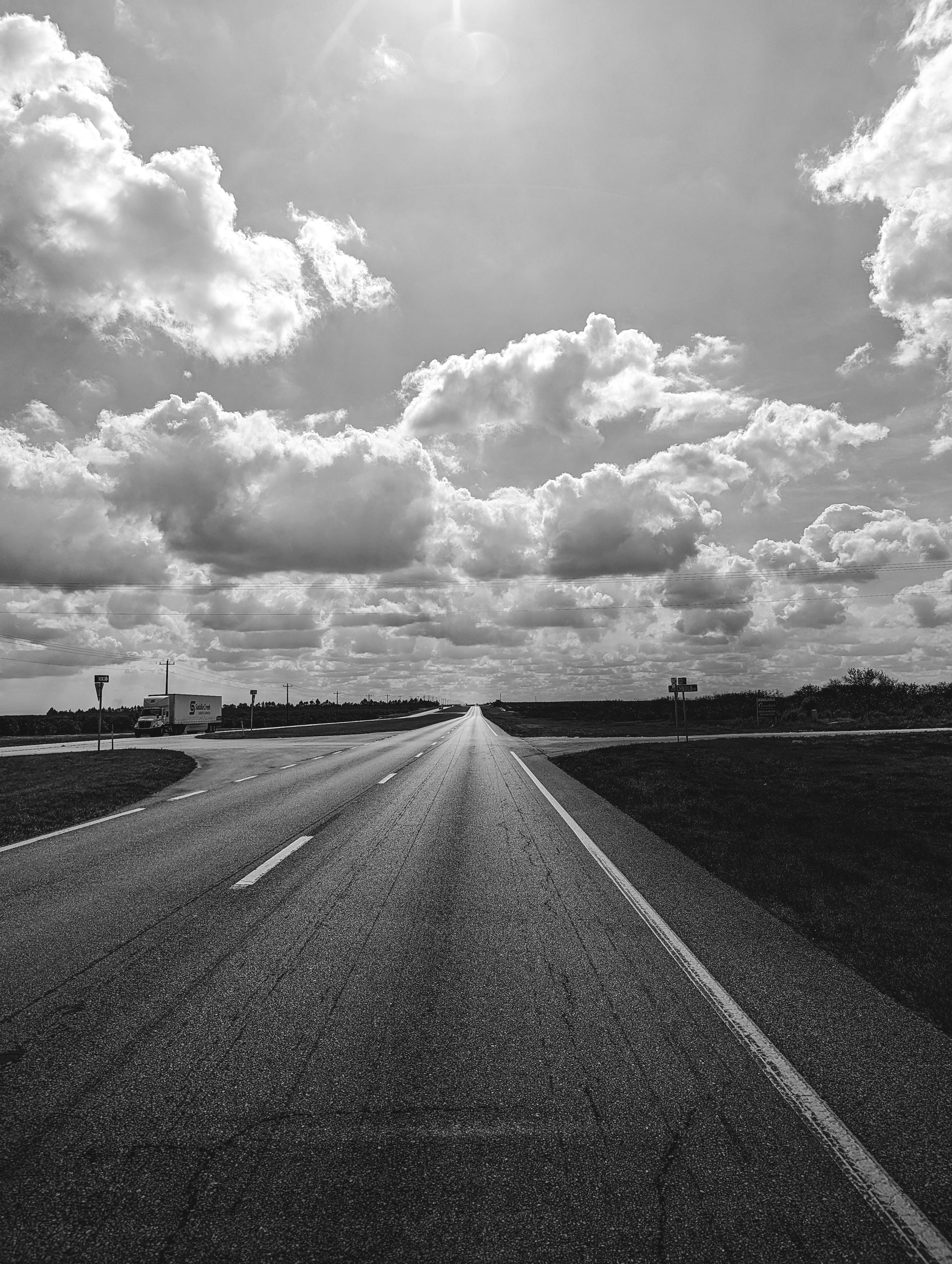 Scenic Open Road Under Dramatic Cloudy Sky · Free Stock Photo