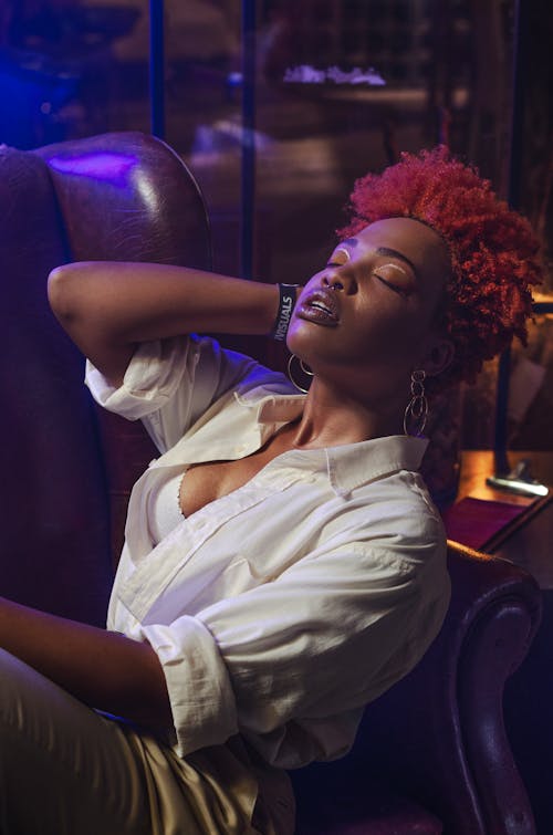 Photo Of Woman Sitting On Chair