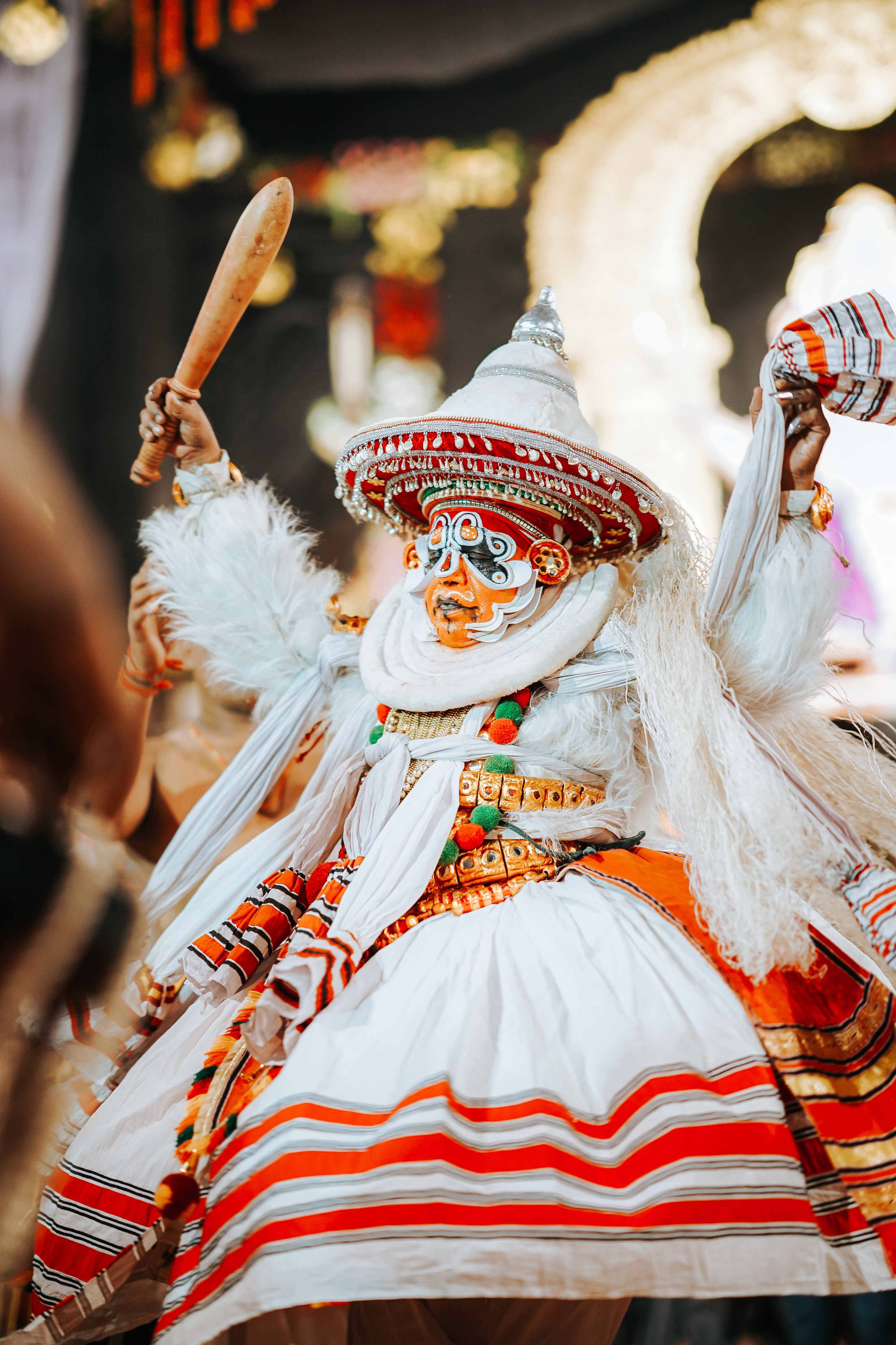 Colorful Theyyam dancer captured during a vibrant performance in Nagpur, India.