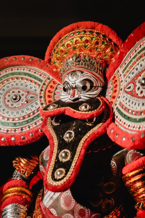 Free Close-up of a vibrant Theyyam costume showcasing traditional artistry. Stock Photo