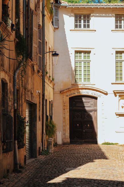 Charming Gothic street scene in Avignon, France showcasing historic architecture.