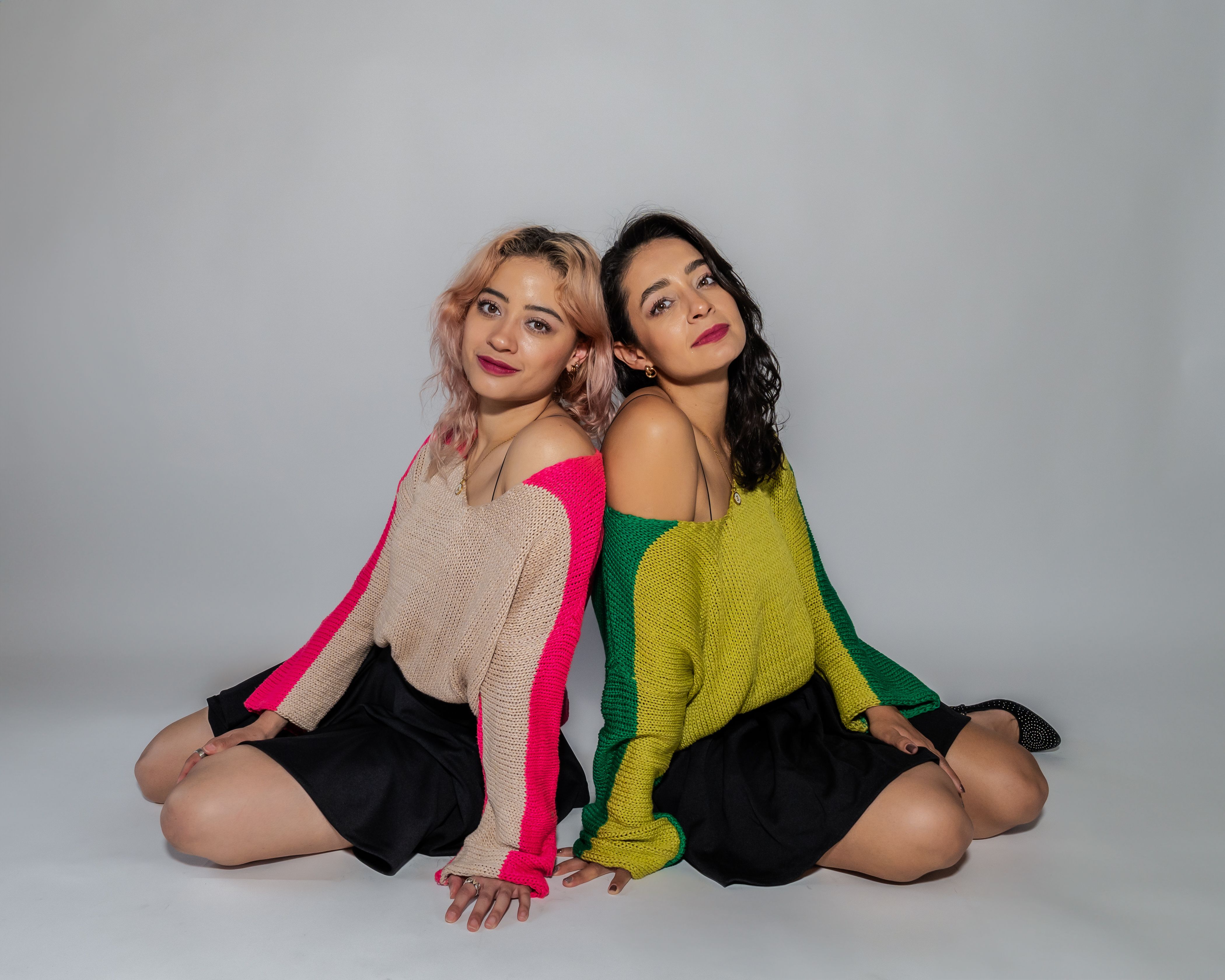 Isabela Merced and Bella Ramsey in character as Dina and Ellie in Seattle