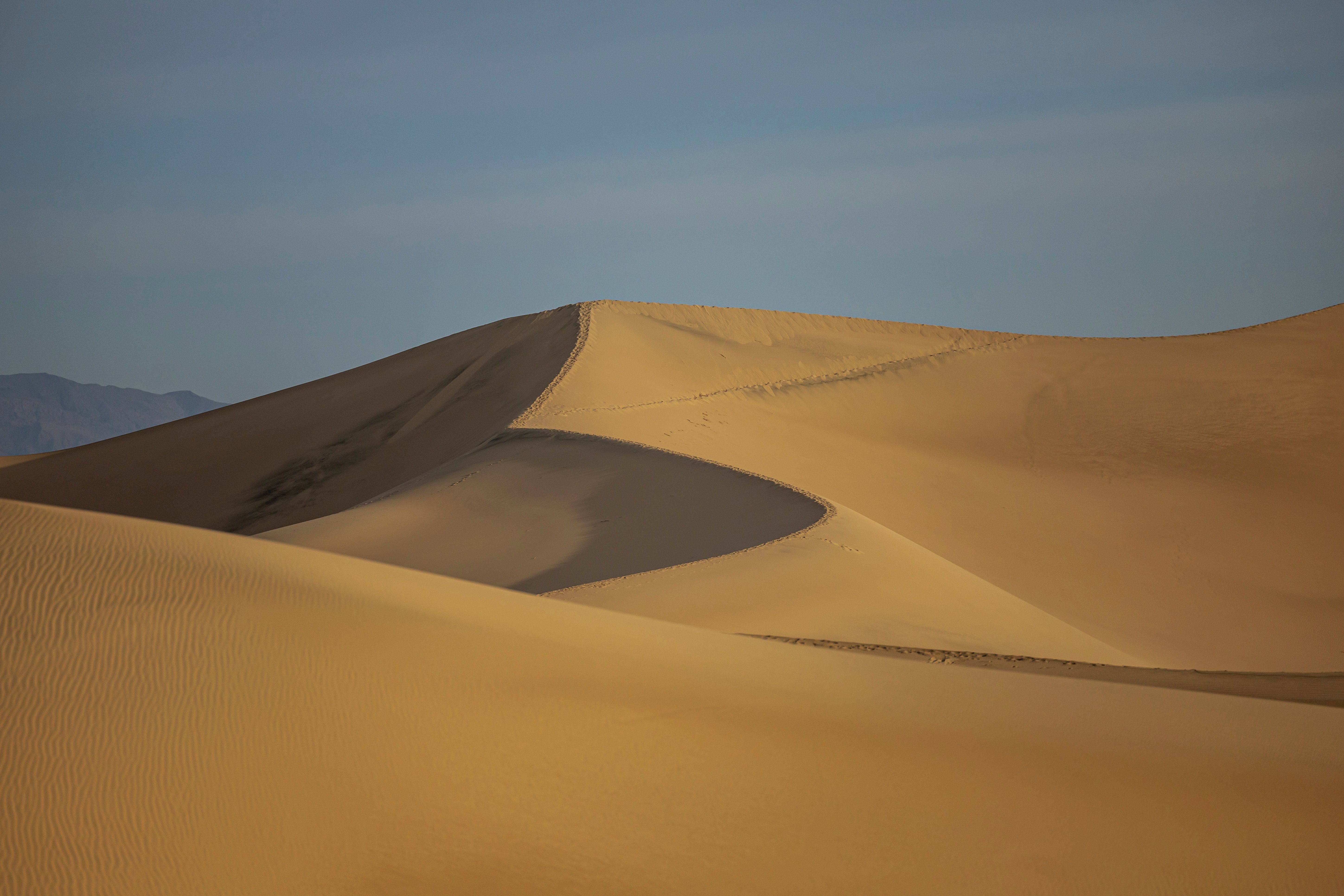 Golden Sand Dunes Under Bright Sky · Free Stock Photo