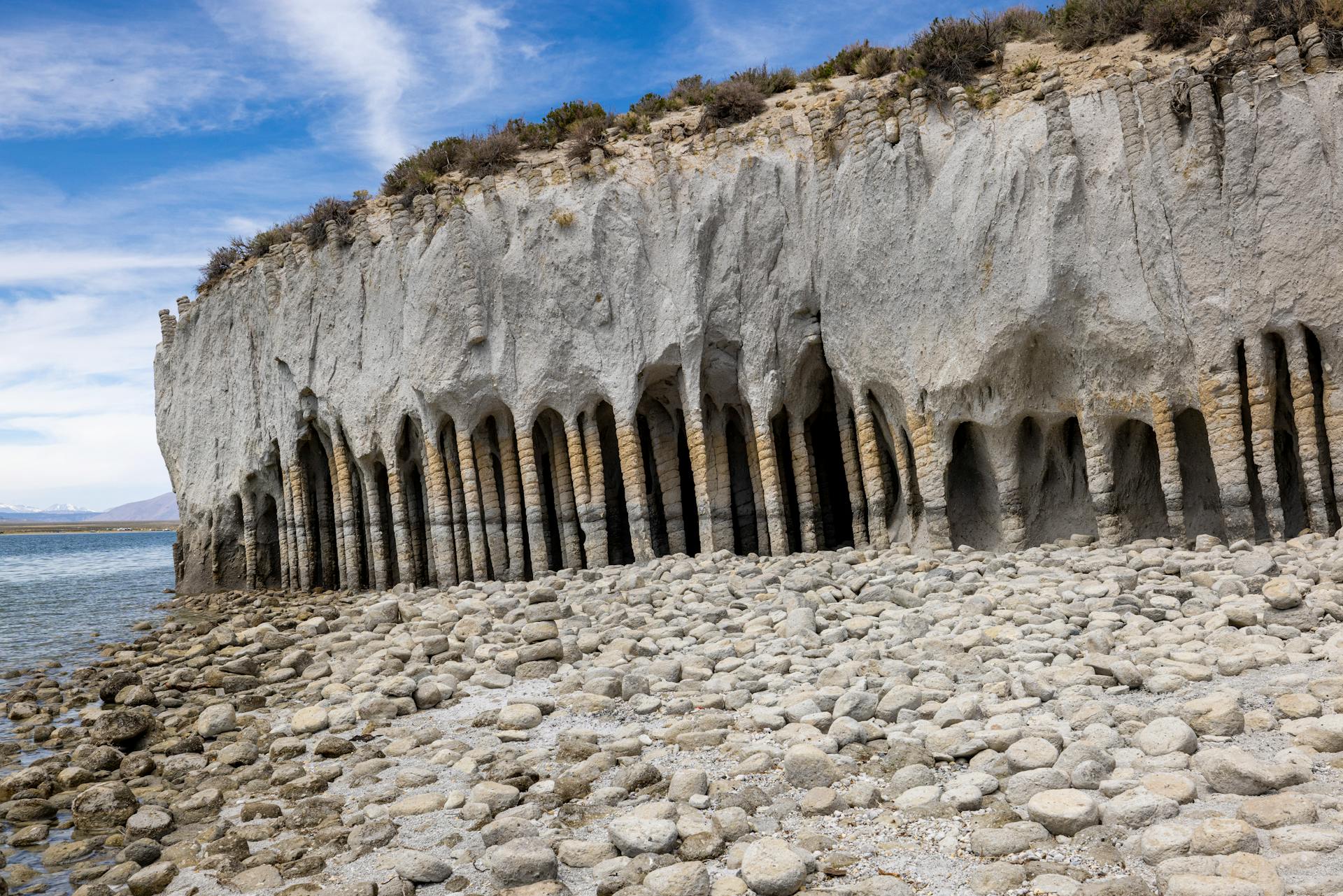 Explore the unique natural hexagonal rock formations along Crowley Lake's stunning shoreline.