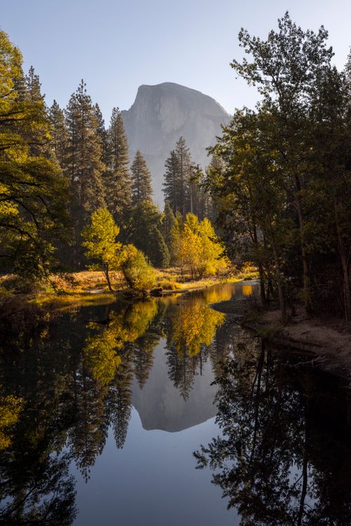 Free Beautiful reflection of Half Dome and autumn trees in Yosemite National Park. Stock Photo