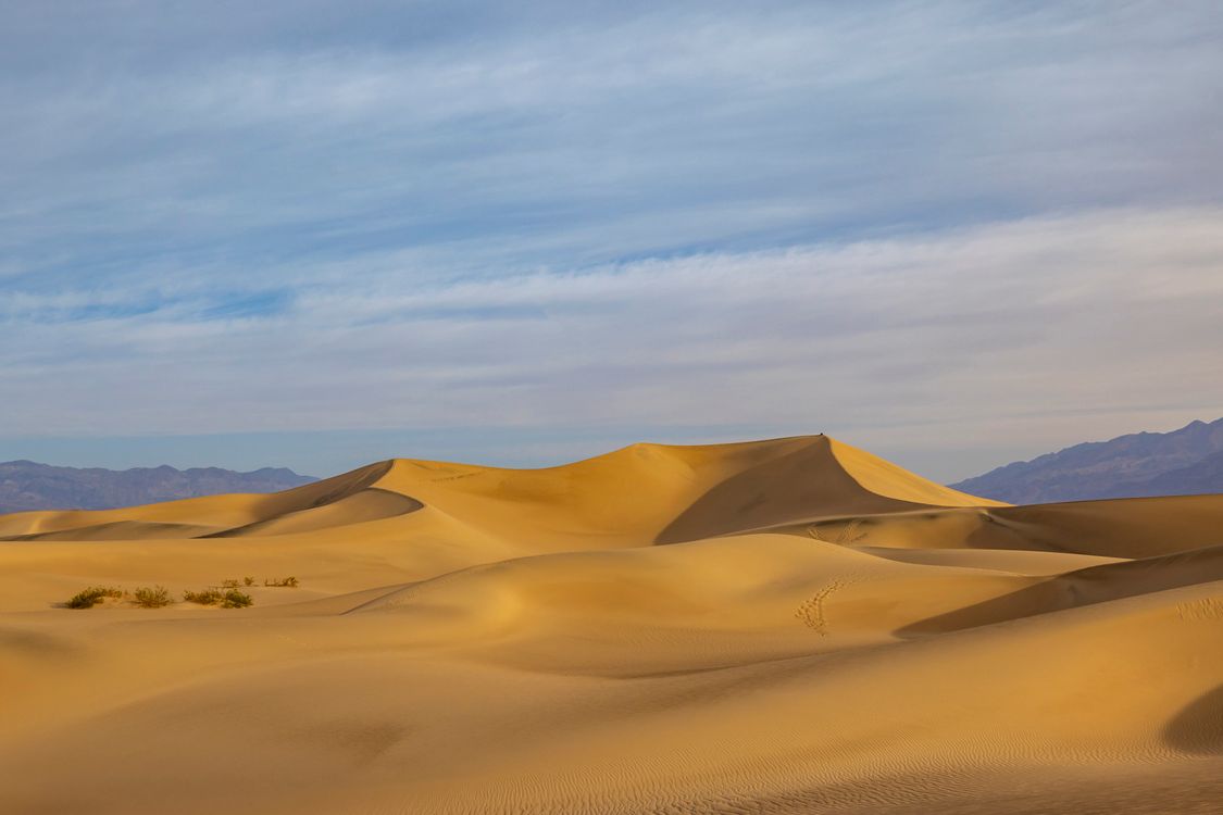 Golden Sand Dunes under a Vast Sky · Free Stock Photo