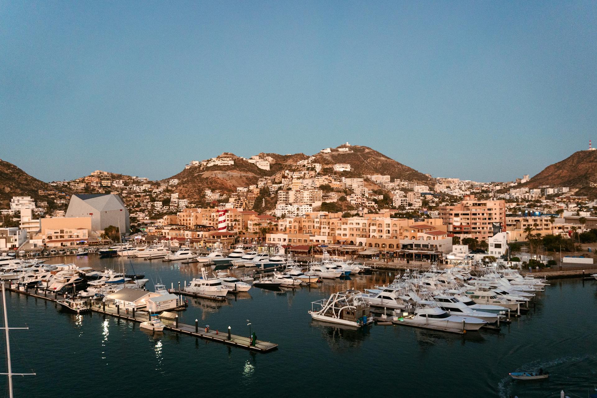 Panoramic view of marina and hills in Cabo San Lucas, Mexico at sunrise.