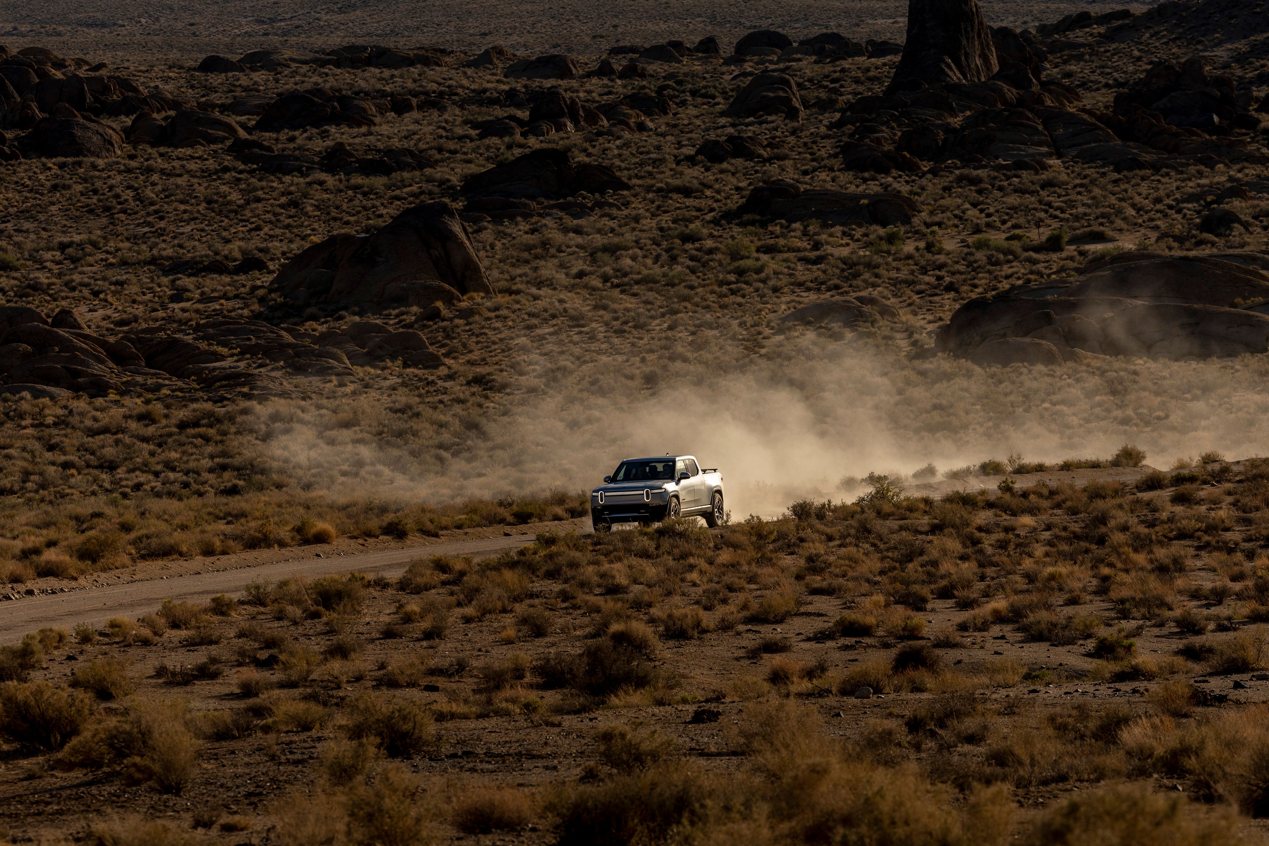 Lifted truck navigating rocky trail with elevated suspension