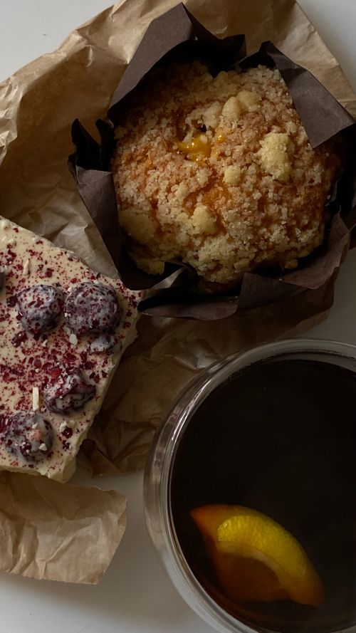 Free Delicious muffin and berry cake with citrus tea, perfect morning treat. Stock Photo