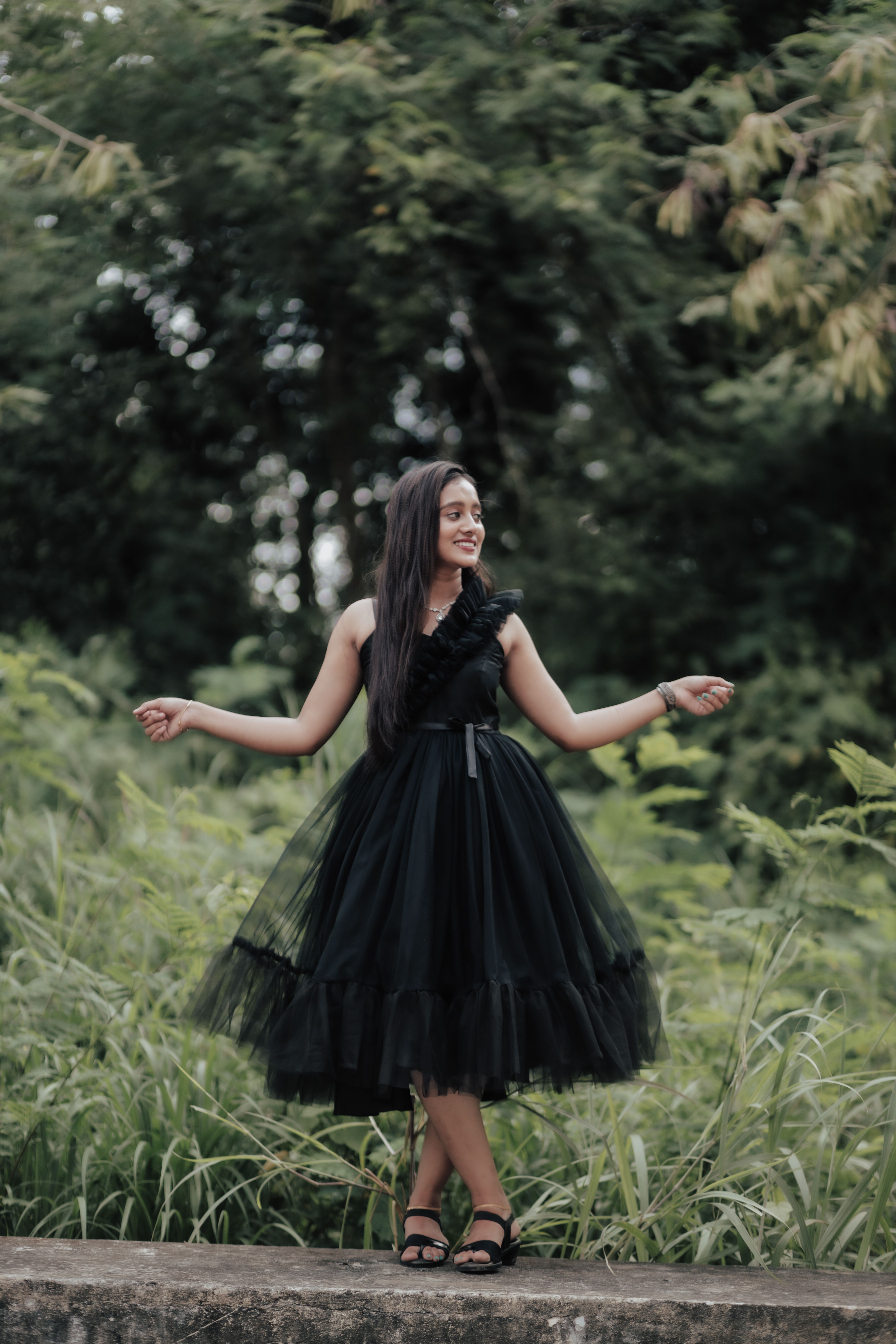 Elegant Woman in Black Dress Outdoors · Free Stock Photo