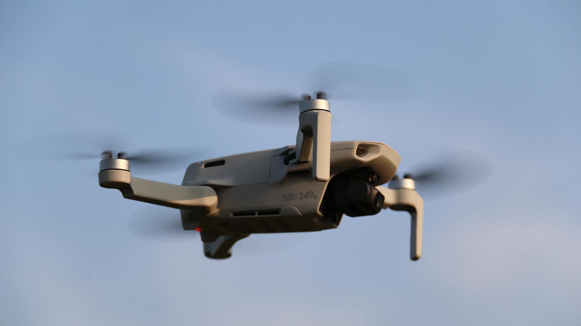 Close-up of Drone in Flight Against Blue Sky
