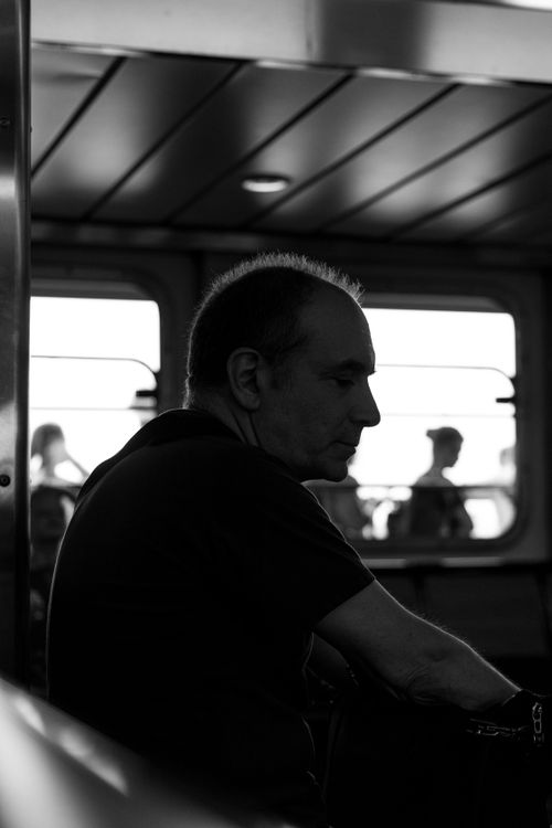 Free Silhouette of a man inside a boat, conveying a moody and introspective tone. Stock Photo