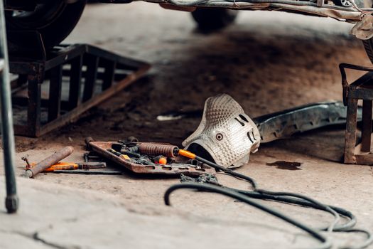 A detailed view of automotive tools and equipment in a workshop, perfect for repair and maintenance.