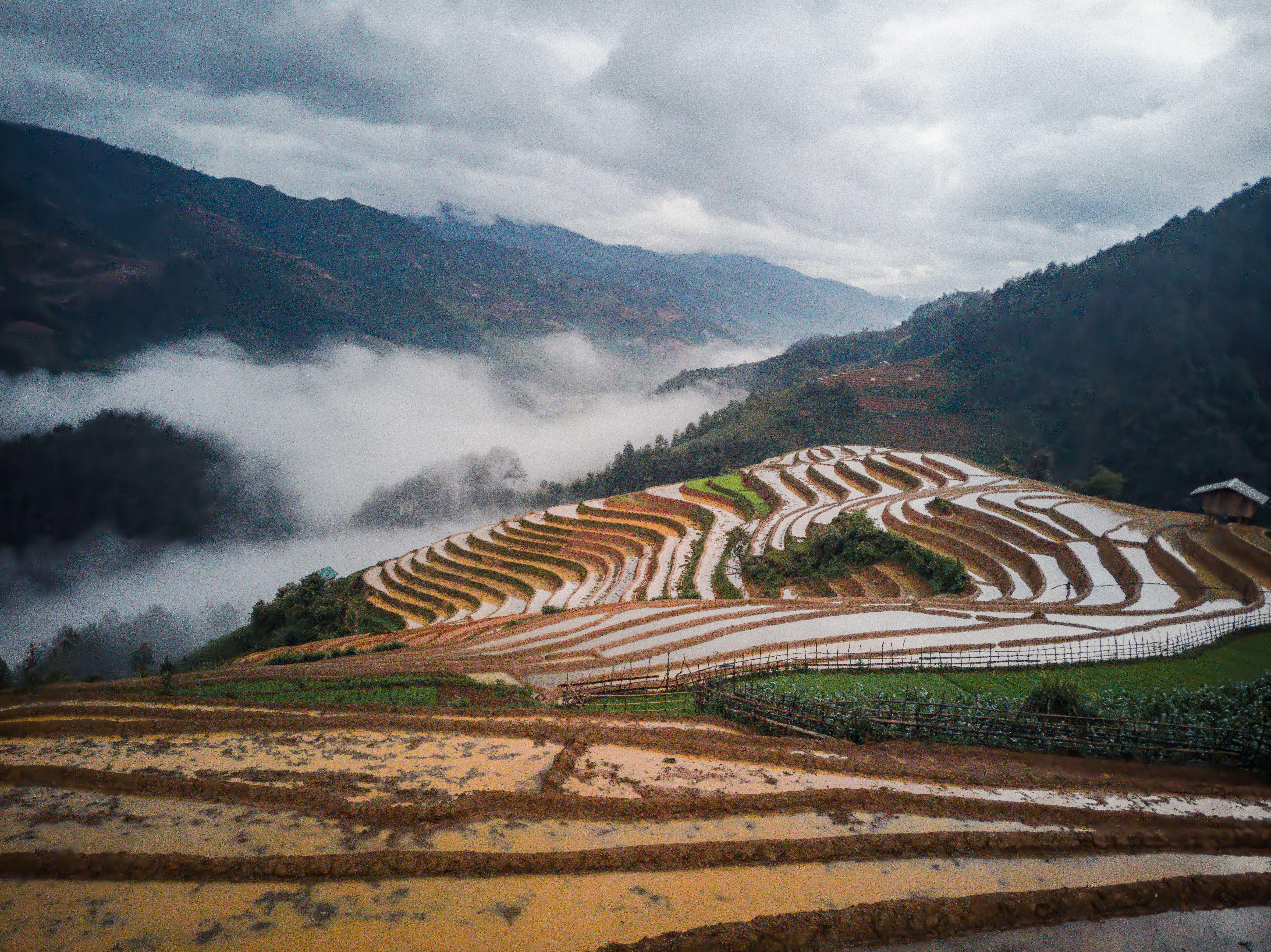 Misty mountain landscape with terraced farms near Ho, Ghana