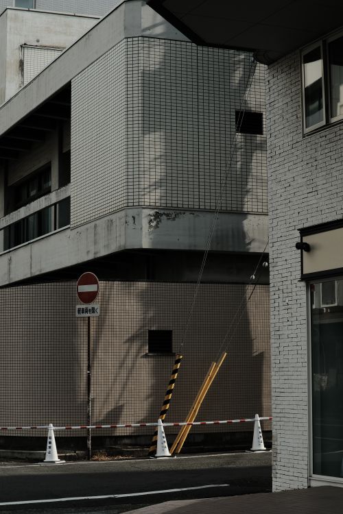 Free Modern city street scene with geometric architecture and shadows. Stock Photo