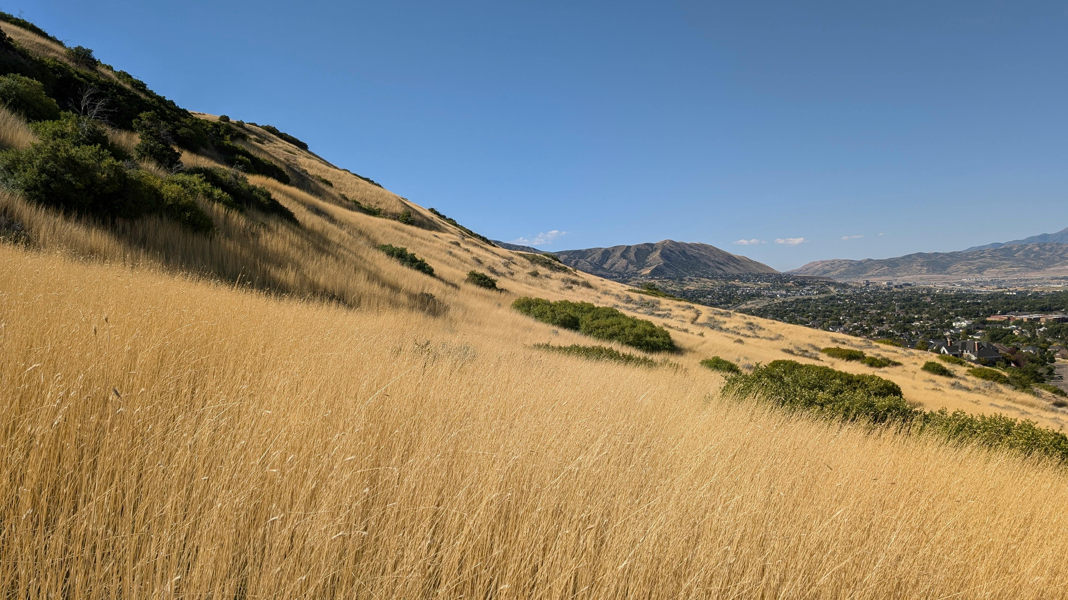 AC maintenance unit outside a Draper Utah home with Wasatch Front mountains in background - ac maintenance in draper ut