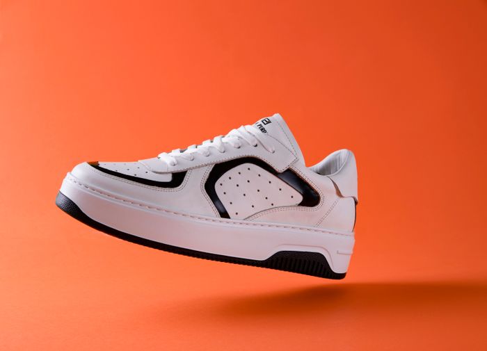 White sport shoe photographed by Atakan Tok on Pexels