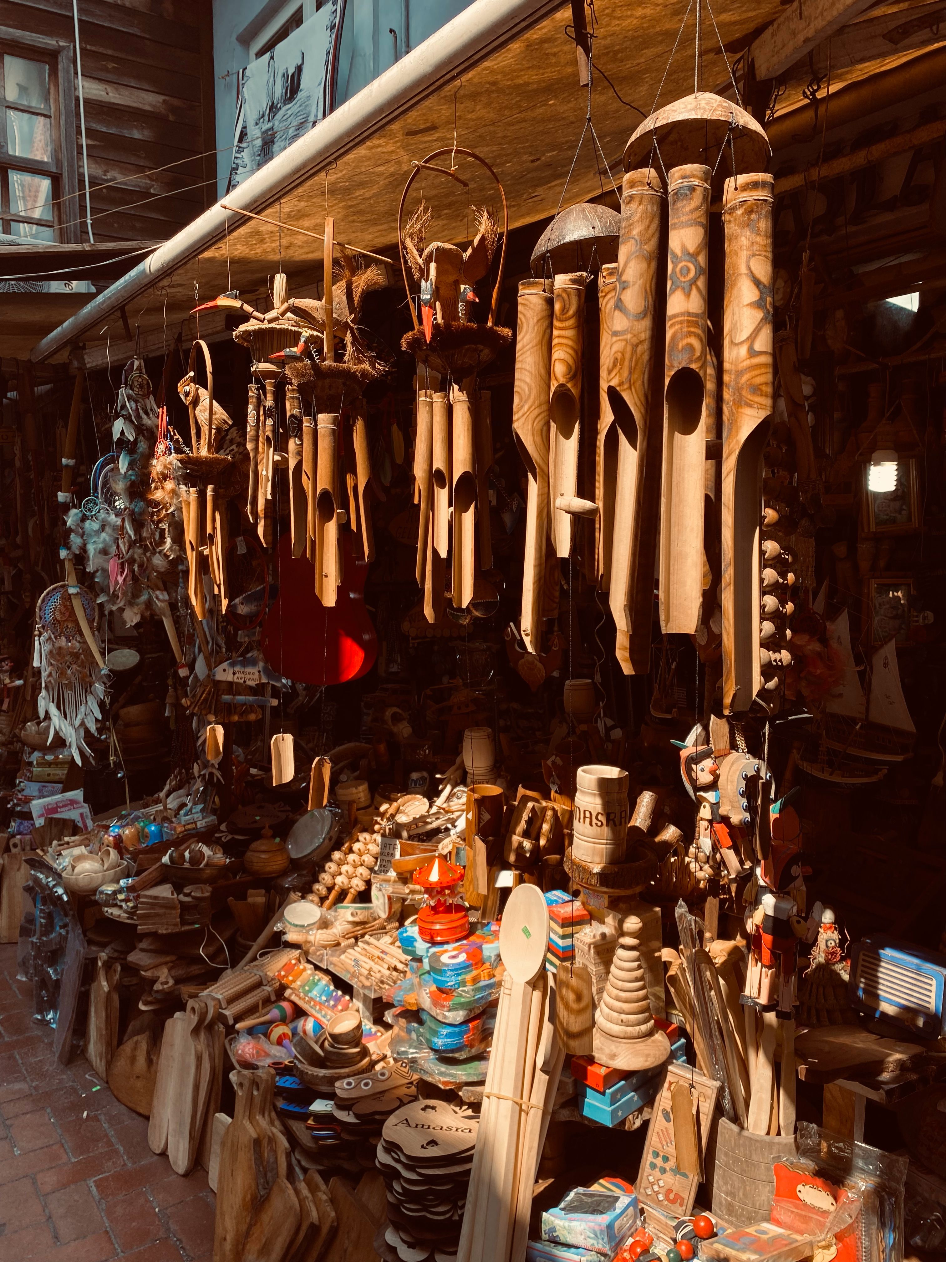 Rustic Market with Wooden Crafts and Wind Chimes · Free Stock Photo