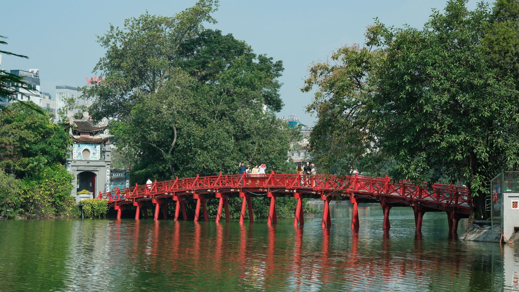 Scenic view of the red bridge over Hoan Kiem Lake in Hanoi, Vietnam.
