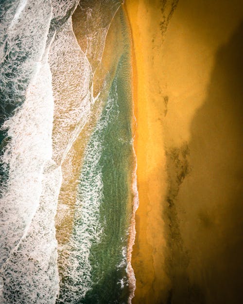 Aerial Photography of Waves Hitting Seashore