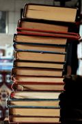 A tall stack of old books — photo by Zehra Güven on Pexels