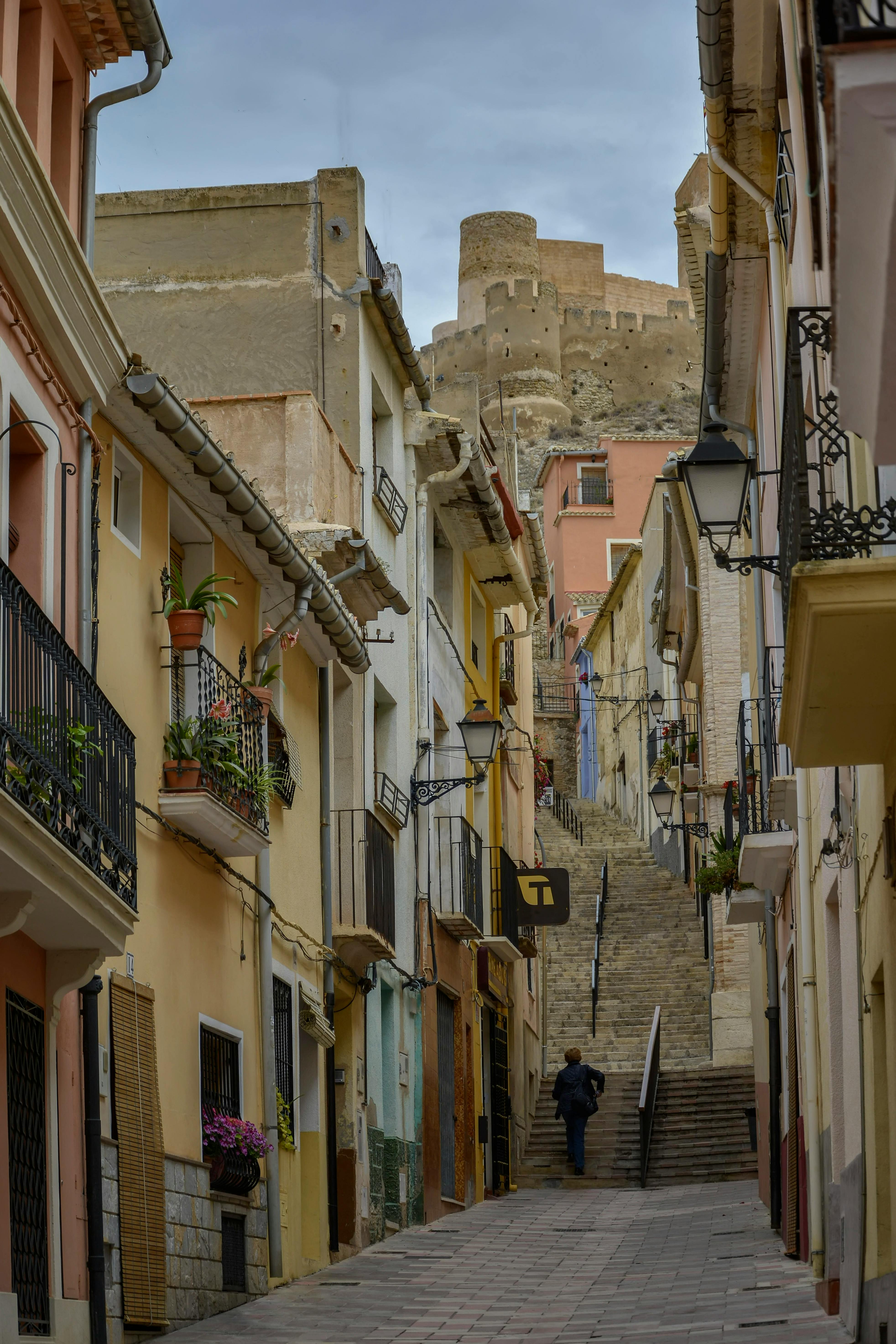 scenic street view with castle in biar spain