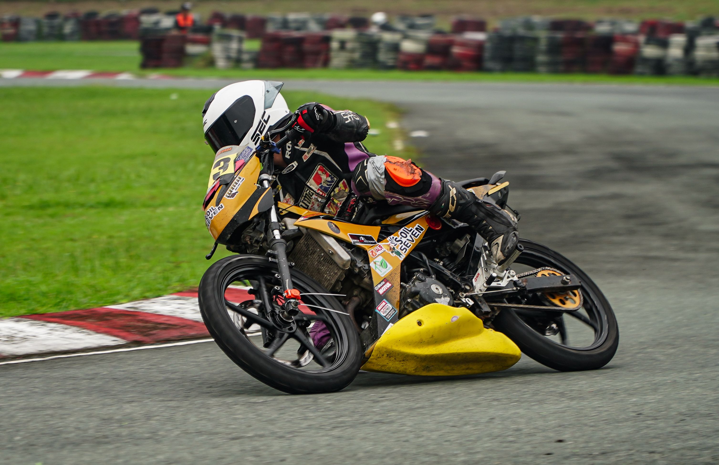 High-speed motorcycle racing on a track in Tarlac City, Philippines.