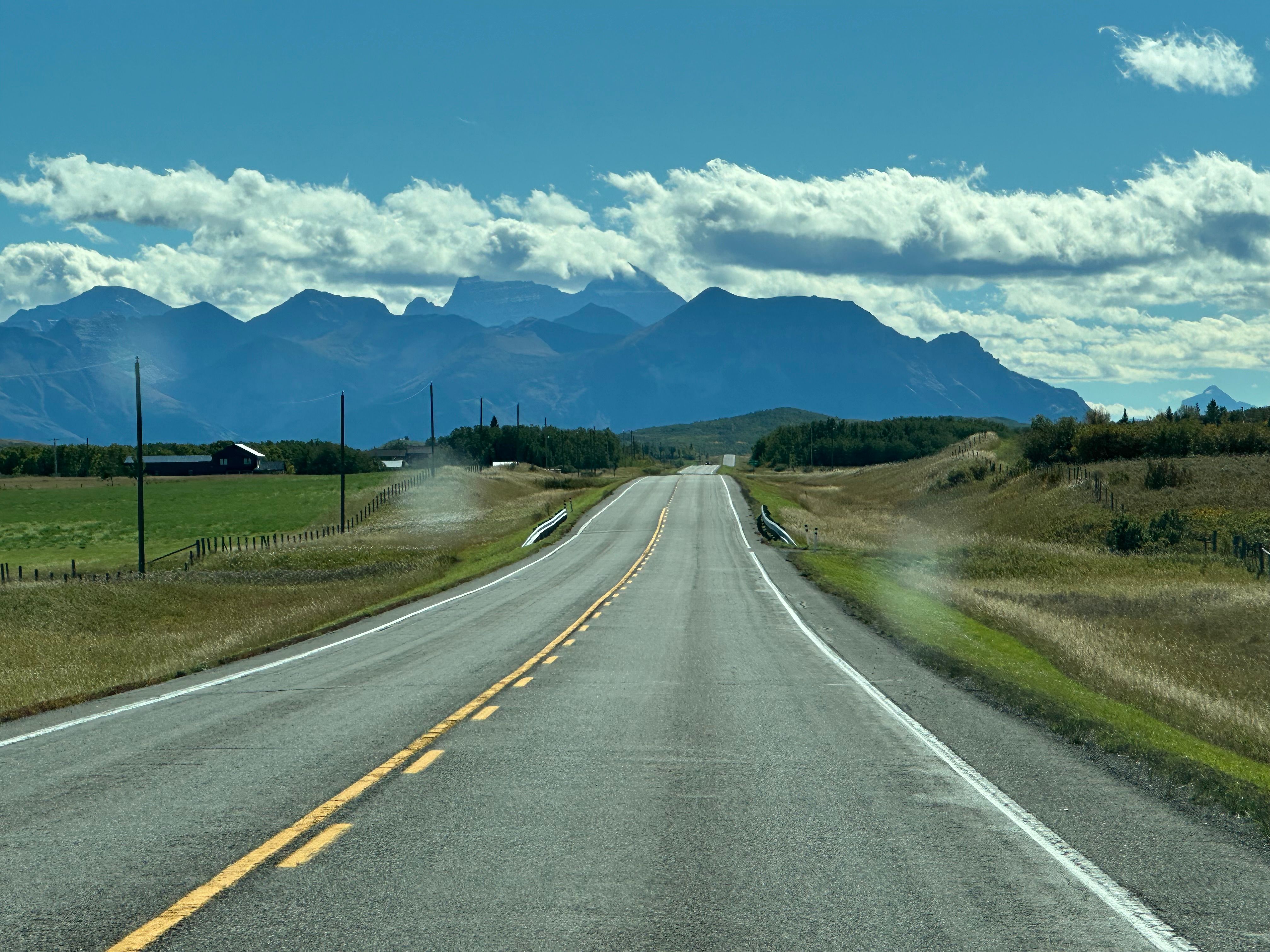Scenic view of the paved road to Arusha with Mount Meru in the background