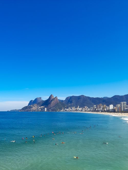 Free Beautiful perspective of Ipanema Beach with Two Brothers Mountain in Rio de Janeiro, Brazil. Stock Photo