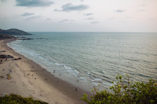Free A breathtaking aerial view of Chapora Beach, India, showcasing the serene coastline at sunset. Stock Photo