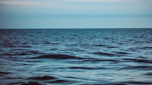 Free Peaceful blue sea and horizon line during twilight, evoking calm and tranquility. Stock Photo