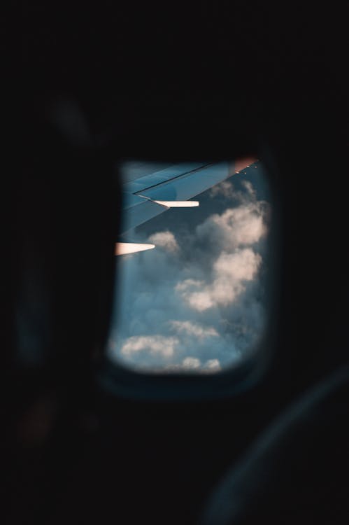 Aircraft Wing and Cloudy Sky