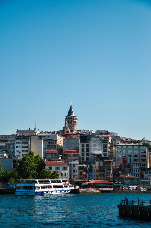 Free Beautiful urban landscape featuring the iconic Galata Tower and boats in Istanbul, Turkey. Stock Photo