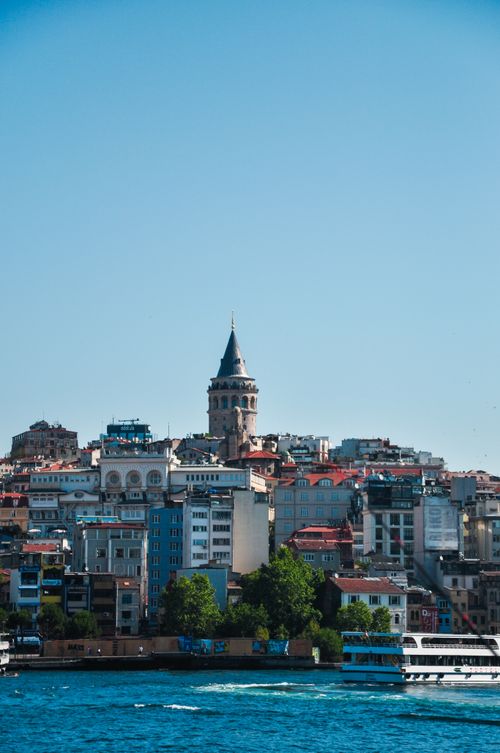 Free Beautiful view of the Galata Tower with the vibrant skyline of Istanbul under a clear blue sky. Stock Photo