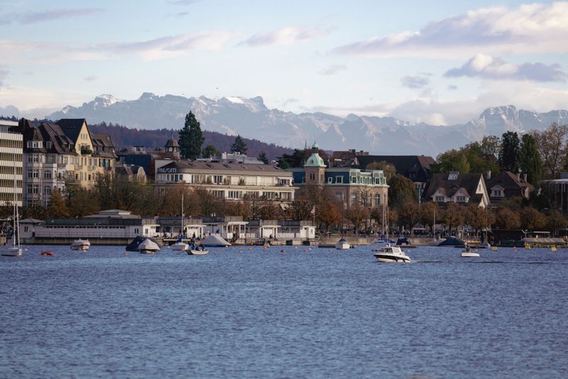 Scenic view of Zurich waterfront and the Swiss Alps over Lake Zurich