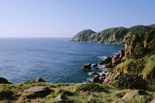 Free Breathtaking view of rocky cliffs and ocean in Phú Yên, Vietnam, under a clear sky. Stock Photo