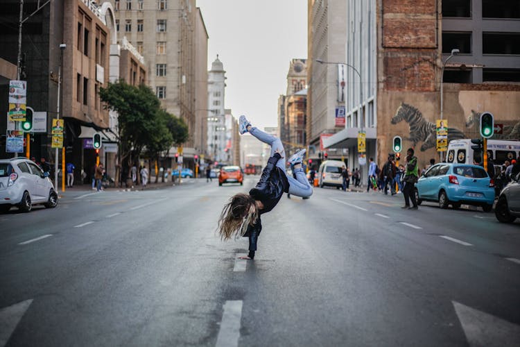 Woman Breakdancing On Street