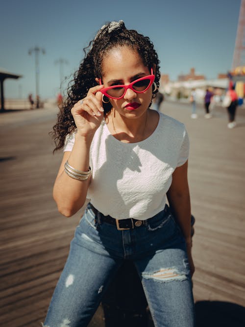 Photo Of Woman Touching Her Sunglasses