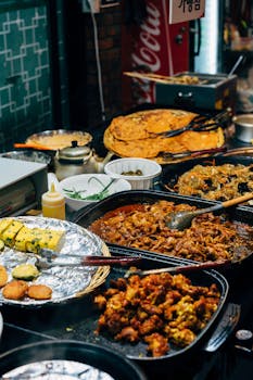 Vibrant spread of traditional Korean street food in a bustling Seoul market.